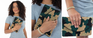 Second image in slideshow of girl holding camo bead print clutch